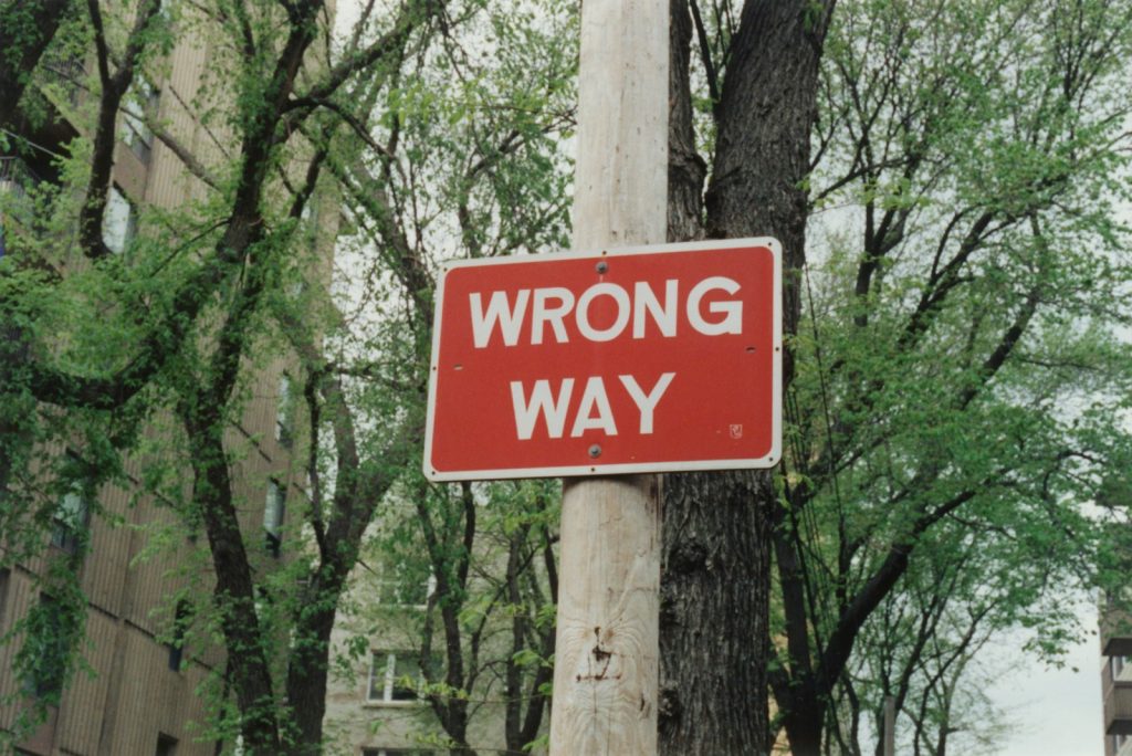 red and white wrong way sign